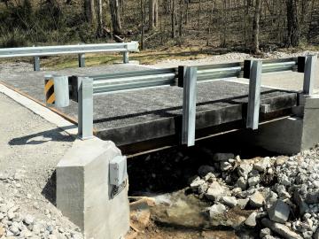 A lightweight bridge deck system in Morgan County required less time to install than a traditional concrete bridge, reducing energy costs and on-site construction costs. Credit: IACMI