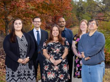 Radiation Safety Information Computational Center staff gather to observe the center’s 60th anniversary. From left, Samantha Bowman, Tim Valentine, Emma York, Ravindra Gadi, Lauren LaLuzerne and Mark Baird. Rebecca Gregor is not shown. Credit: Genevieve Martin, ORNL/U.S. Dept. of Energy