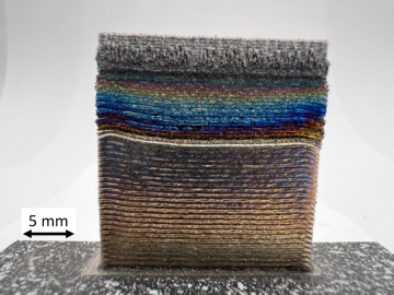 Shown are additively manufactured thin-walled, functionally graded builds from IN718 to C103 alloys, via a thick transition layer having high specific strength. Credit: Brian Jordan, Soumya Nag, ORNL/U.S. Dept. of Energy
