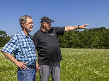 Steve Nolan, left, who manages many ORNL facilities for United Cleanup Oak Ridge, and Carl Dukes worked closely together to accommodate bringing members of the public into the Oak Ridge Reservation to collect distant images from overhead for the BRIAR biometric recognition project. Credit: Carlos Jones/ORNL, U.S. Dept. of Energy