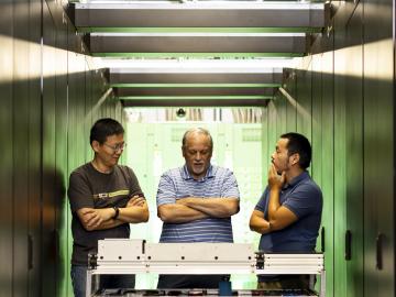 Members of the Analytics and AI Methods at Scale group in the National Center for Computational Sciences at ORNL developed the mixed-precision performance benchmarking tool OpenMxP. From left are group leader Feiyi Wang, technical lead Mike Matheson and research scientist Hao Lu. Credit: Carlos Jones/ORNL, U.S. Dept. of Energy