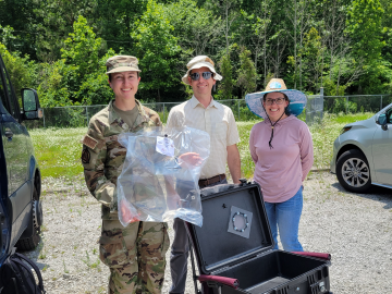 Cadet Elyse Wages, Mike Shaffer and Amanda Sandifer pose with a collected sample of air. Credit: Liz Neunsinger/ORNL, U.S. Dept. of Energy