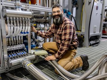 Eric Nafziger, a technical staff member at the National Transportation Research Center at Oak Ridge National Laboratory’s Hardin Valley Campus, supports the installation of the largest alternative fuels research engines for marine and rail in the U.S. Credit: Genevieve Martin/ORNL, U.S. Dept. of Energy