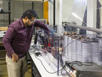 Prasad Kandula builds a medium-voltage solid state circuit breaker as part of ORNL’s project to develop medium-voltage power electronics in GRID-C. Credit: Carlos Jones/ORNL, U.S. Dept. of Energy