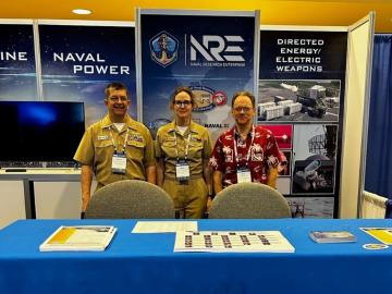 LCDR Rich Harvey, pictured on the left, poses with two colleagues at the 2023 POST Conference. Credit: Rich Harvey