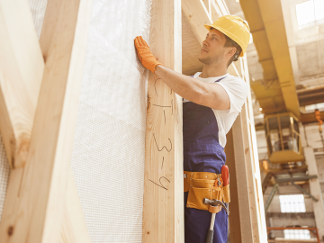 Builder constructing walls