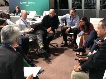 ORNL Distinguished Scientist Edgar Lara-Curzio (second from right) contributed to a working group discussion at COP28 about ways to stimulate demand for hydrogen-based fuels in maritime transportation.