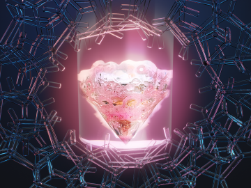 Photo of glowing, pink diamond-shaped figure. This is illuminated with light, encircled with a wreath of around 70 blue tube-like shapes.
