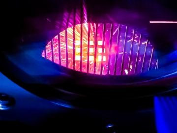 Pictured is a 3D printer that creates objects using electron beam melting, looks like a glowing orb. 