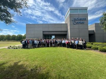 A large group of attendees are pictured outside of Jackson Center in Huntsville, Alabama
