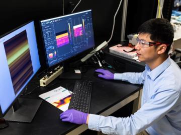 Eugene P. Wigner Fellow Huan Zhao working in his lab