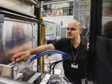 Kushol Gupta adjusts Bio SANS instrument at the High Flux Isotope Reactor. 