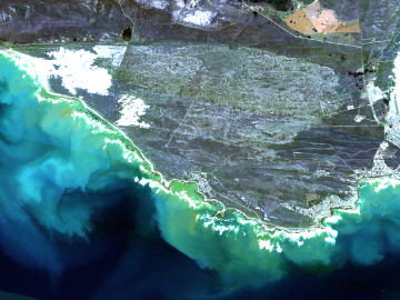 Image is an arial view of the South Africa Cape surrounded by ocean 