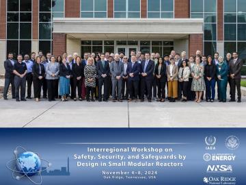 Big group photo standing outside of a brick building with text underneath describing the IAEA workshop on safety, security and safeguards
