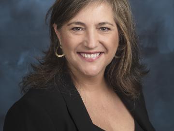 Neus Domingo Marimon, ORNL scientist, poses for a photo in black with hair down