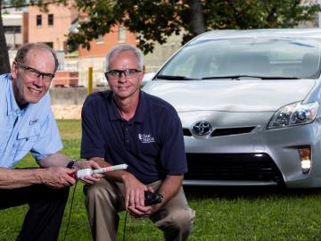 L-R, ORNL’s Bruce Warmack, Nance Ericson with an early prototype of the Hot Stick (ORNL photographer Carlos Jones).