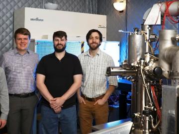 Eugene Dumitrescu, Ben Lawrie, Matthew Feldman, and Jordan Hachtel (from left) have conducted investigations aimed at controlling the dissipative nature of quantum systems and materials. The cathodoluminescence microscope used in their work appears at rig Eugene Dumitrescu, Ben Lawrie, Matthew Feldman, and Jordan Hachtel (from left) have conducted investigations aimed at controlling the dissipative nature of quantum systems and materials. The cathodoluminescence microscope used in their work appears at rig