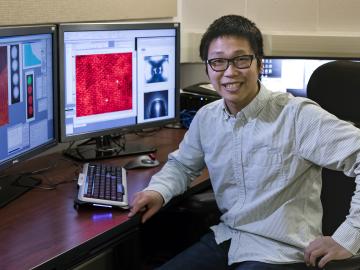 ORNL’s Xiahan Sang unambiguously resolved the atomic structure of MXene, a 2D material promising for energy storage, catalysis and electronic conductivity. Image credit: Oak Ridge National Laboratory, U.S. Dept. of Energy; photographer Carlos Jones ORNL’s Xiahan Sang unambiguously resolved the atomic structure of MXene, a 2D material promising for energy storage, catalysis and electronic conductivity. Image credit: Oak Ridge National Laboratory, U.S. Dept. of Energy; photographer Carlos Jones