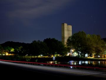 The silo-shaped tower for the 25-megavolt Tandem Electrostatic Accelerator also serves as an ORNL landmark.