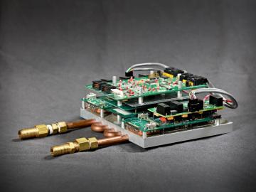 ORNL is co-developing a prototype device, known as a Smart Power Integrated Node or SPIN, which is designed to route multiple direct current energy sources in a home. Credit: Jason Richards/Oak Ridge National Laboratory, U.S. Dept. of Energy ORNL is co-developing a prototype device, known as a Smart Power Integrated Node or SPIN, which is designed to route multiple direct current energy sources in a home. Credit: Jason Richards/Oak Ridge National Laboratory, U.S. Dept. of Energy