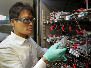 ORNL researcher and University of Tennessee Bredesen Center for Interdisciplinary Research and Graduate Education student Seong Jin An works with lithium-ion batteries undergoing an ORNL-developed fast-formation protocol that shortens part of battery. ORNL researcher and University of Tennessee Bredesen Center for Interdisciplinary Research and Graduate Education student Seong Jin An works with lithium-ion batteries undergoing an ORNL-developed fast-formation protocol that shortens part of battery