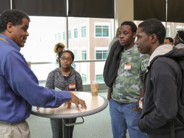 Knox County Commissioner and Oak Ridge National Laboratory Neutron Sciences Directorate employee Sam McKenzie talks to students from Knoxville’s Austin-East High School about career opportunities in science, technology, engineering and math during the