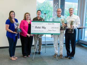 Oak Ridge National Laboratory’s United Way campaign's $900,000 “big check” with, from left, Ann Weaver, Sharon Kohler, Ken Tobin, Jimmy Stone, and David Keim. ORNL photo by Genevieve Martin