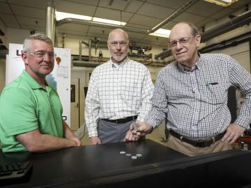 From left, ORNL’s Rick Lowden, Chris Bryan and Jim Kiggans were troubled that target discs of a material needed to produce Mo-99 using an accelerator could deform after irradiation and get stuck in their holder. From left, ORNL’s Rick Lowden, Chris Bryan and Jim Kiggans were troubled that target discs of a material needed to produce Mo-99 using an accelerator could deform after irradiation and get stuck in their holder.