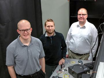Joseph Lukens, Raphael Pooser, and Nick Peters (from left) of ORNL’s Quantum Information Science Group developed and tested a new interferometer made from highly nonlinear fiber in pursuit of improved sensitivity at the quantum scale. Credit: Carlos Jones