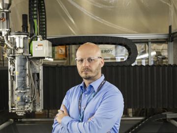 Composites scientist and engineer Vlastimil Kunc with the latest large-scale 3Dprinter at the MDF. Composites scientist and engineer Vlastimil Kunc with the latest large-scale 3Dprinter at the MDF.