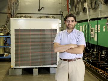 Omar Abdelaziz in ORNL’s Maximum Building Energy Efficiency Research Laboratory (MAXLAB). Photo credit: Jason Richards