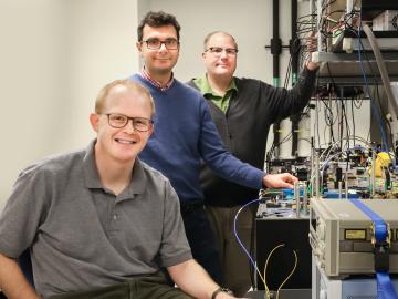 Joseph Lukens, Pavel Lougovski and Nicholas Peters (from left), researchers with ORNL’s Quantum Information Science Group, are examining methods for encoding photons with quantum information that are compatible with the existing telecommunications infrast