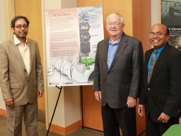 An ORNL technology that converts waste rubber into a valuable energy storage material has been licensed to RJ Lee Group. ORNL inventors Amit Naskar (left) and Parans Paranthaman flank Richard Lee, CEO of RJ Lee Group. 