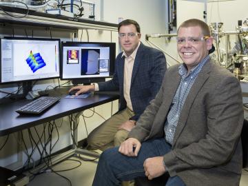 ORNL software engineer Eric Lingerfelt (right) and Stephen Jesse (left) of ORNL’s Center for Nanophase Materials Sciences led the development of the Bellerophon Environment for Analysis of Materials (BEAM).