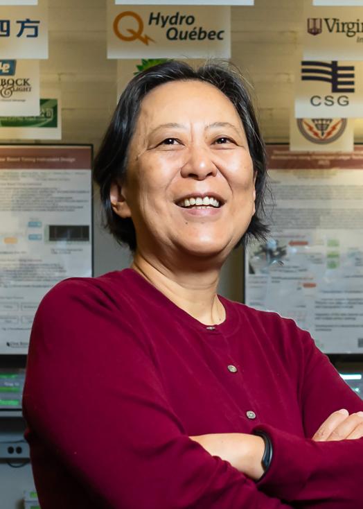 ORNL researcher Yilu Liu poses in office