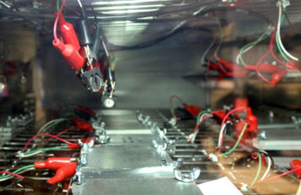 Pouch and coin cells being tested in an environmental chamber held at 30°C