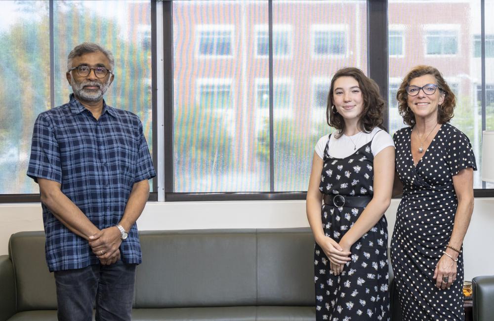 ORNL Director Thomas Zacharia congratulates UT-Battelle Scholarship winner Christiane Alvarez and her mother, Rosemary Walker of Creative Services. Credit: Carlos Jones/Oak Ridge National Laboratory, U.S. Dept. of Energy