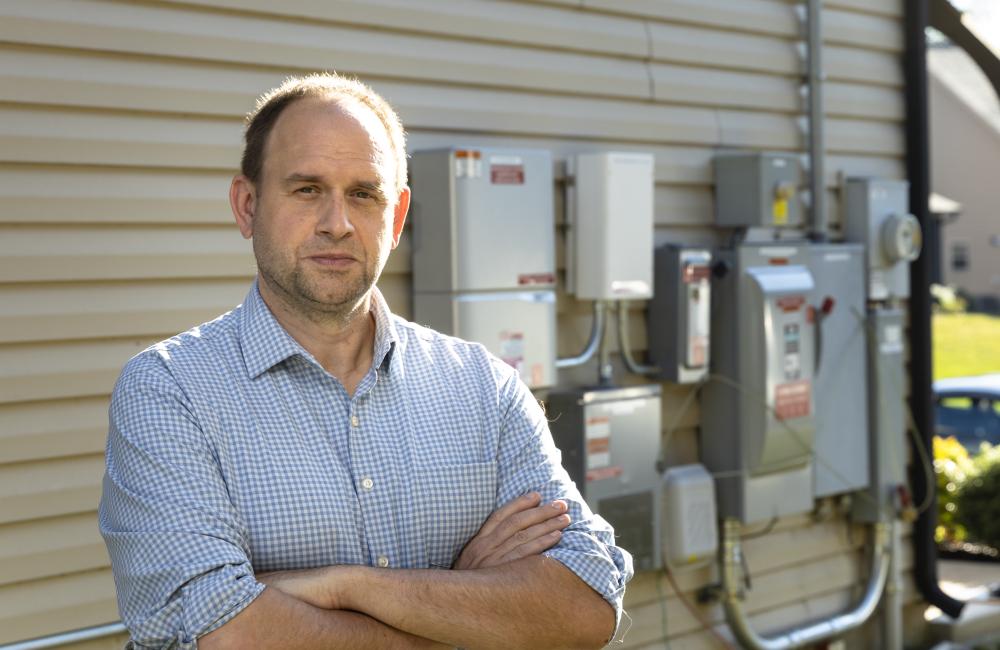 Joe Hagerman is expanding connected neighborhood research at ORNL and envisions buildings of the future as resources capable of managing the flow and exchange of energy based on economic and market signals – a concept known as transactive energy. Credit: Carlos Jones, Oak Ridge National Laboratory, U.S. Department of Energy