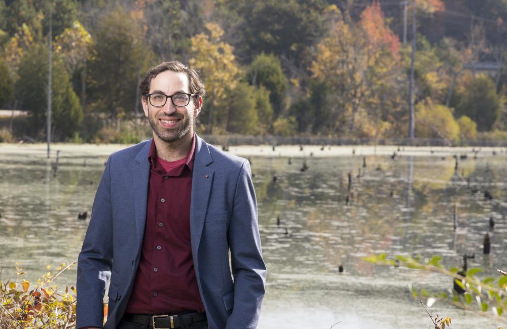 Benjamin Sulman, a scientist in ORNL’s Environmental Sciences Division, creates Earth system models that simulate how plants, microbes and soils interact and influence the cycling of carbon, water and nutrients in their environment. His work aims to helps researchers across disciplines better understand complex, rapidly changing ecosystems, including coastal wetlands and Arctic permafrost soils. Credit: Carlos Jones/ORNL, U.S. Dept. of Energy