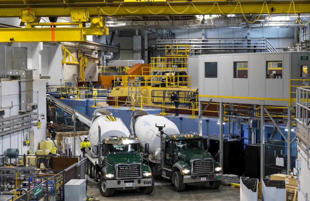 Trucks deliver concrete to the VENUS instrument construction site at the Spallation Neutron Source. Credit: Carlos Jones/ORNL