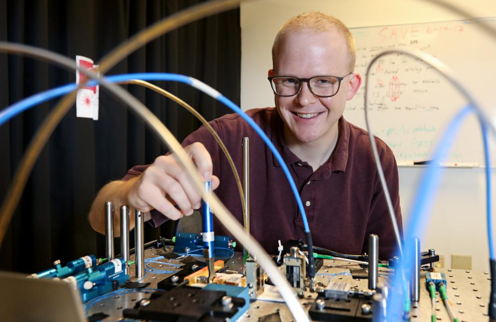 ORNL's Joseph Lukens runs experiments in an optics lab. Credit: Jason Richards/ORNL, U.S. Dept. of Energy