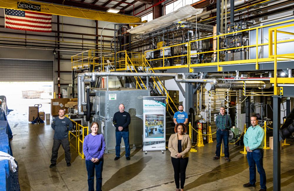Group of staff standing in CFTF high bay 