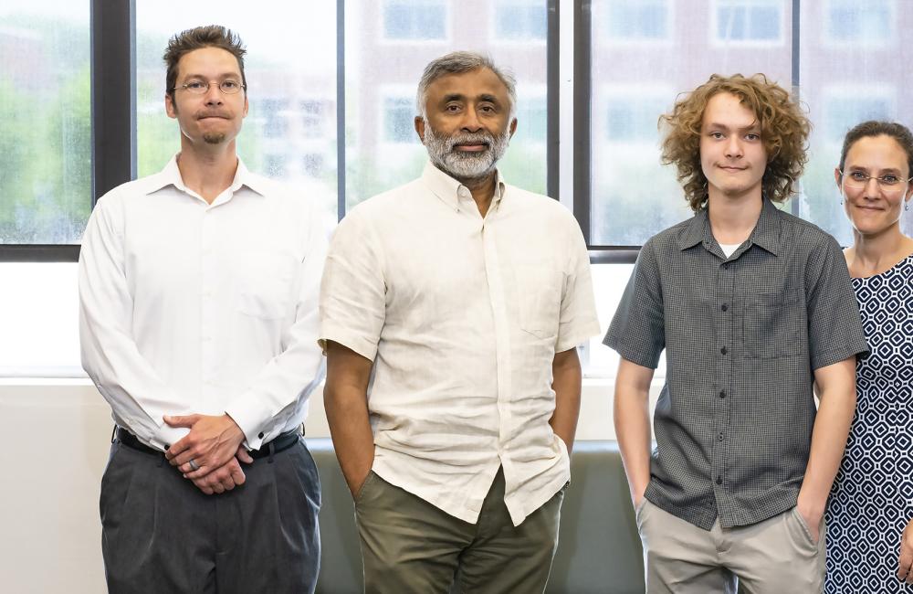 UT-Battelle Scholarship recipient James Rogers, second from right, and parents David, left, and Melanie Rogers are congratulated by ORNL Director Thomas Zacharia. Credit: Carlos Jones/ORNL, U.S. Dept. of Energy
