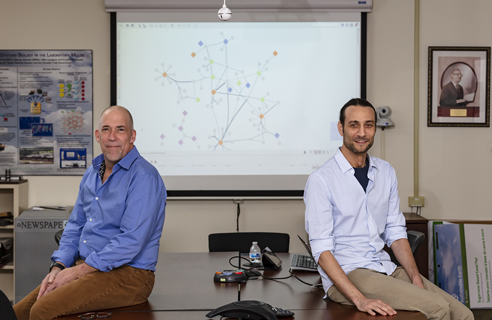 ORNL researchers led by Michael Garvin, left, and David Kainer discovered genetic mutations called structural variants and linked them to autism spectrum disorders, demonstrating an approach that could be used to develop better diagnostics and drug therapies. Credit: Carlos Jones/ORNL, U.S. Dept. of Energy