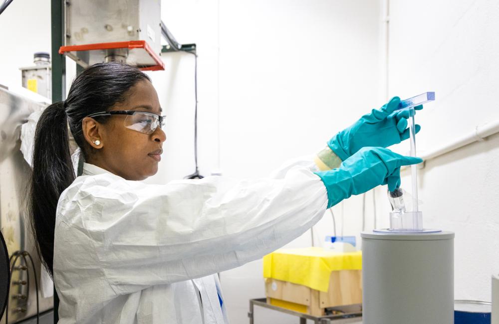 A researcher works in a lab in the Radiochemical Engineering and Development Center, or REDC,  at ORNL’s main campus. The REDC provides world-class capabilities in isotope production, research and development, source fabrication, and the distribution of various unique isotopes. Here, experts handle some of the most exotic materials in the world. Credit: Carlos Jones, ORNL/U.S. Dept. of Energy