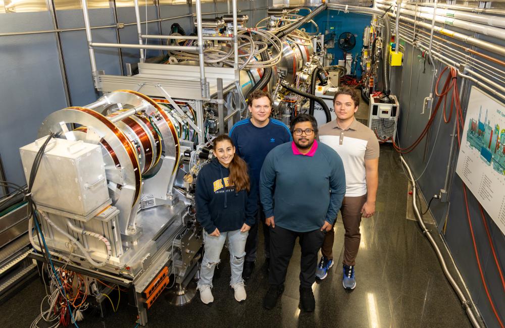 From left are UWindsor students Isabelle Dib, Dominik Dziura, Stuart Castillo and Maksymilian Dziura at ORNL’s Neutron Spin Echo spectrometer. Their work advances studies on a natural cancer treatment. Credit: Genevieve Martin/ORNL, U.S. Dept. of Energy