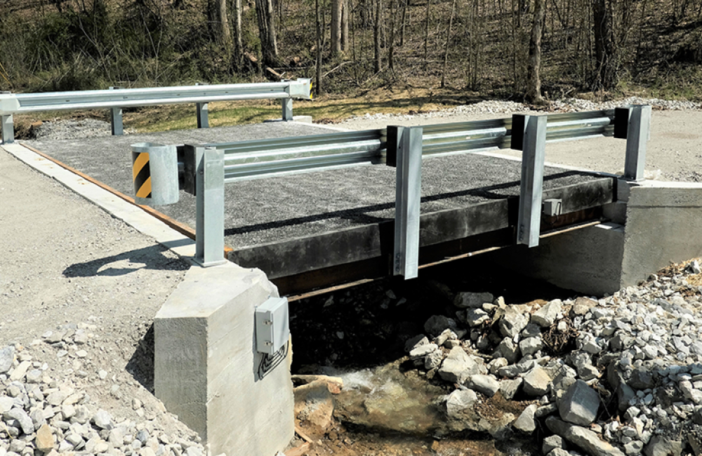 A lightweight bridge deck system in Morgan County required less time to install than a traditional concrete bridge, reducing energy costs and on-site construction costs. Credit: IACMI