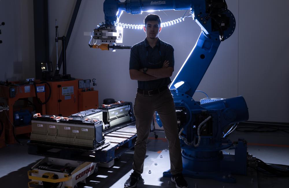 Jonathan Harter, a technical professional in ORNL’s Engineering Science and Technology Directorate, uses a robot and other automated methods to disassemble electric vehicle batteries for recycling or reuse in the electric grid. Credit: Carlos Jones/ORNL, U.S. Dept. of Energy