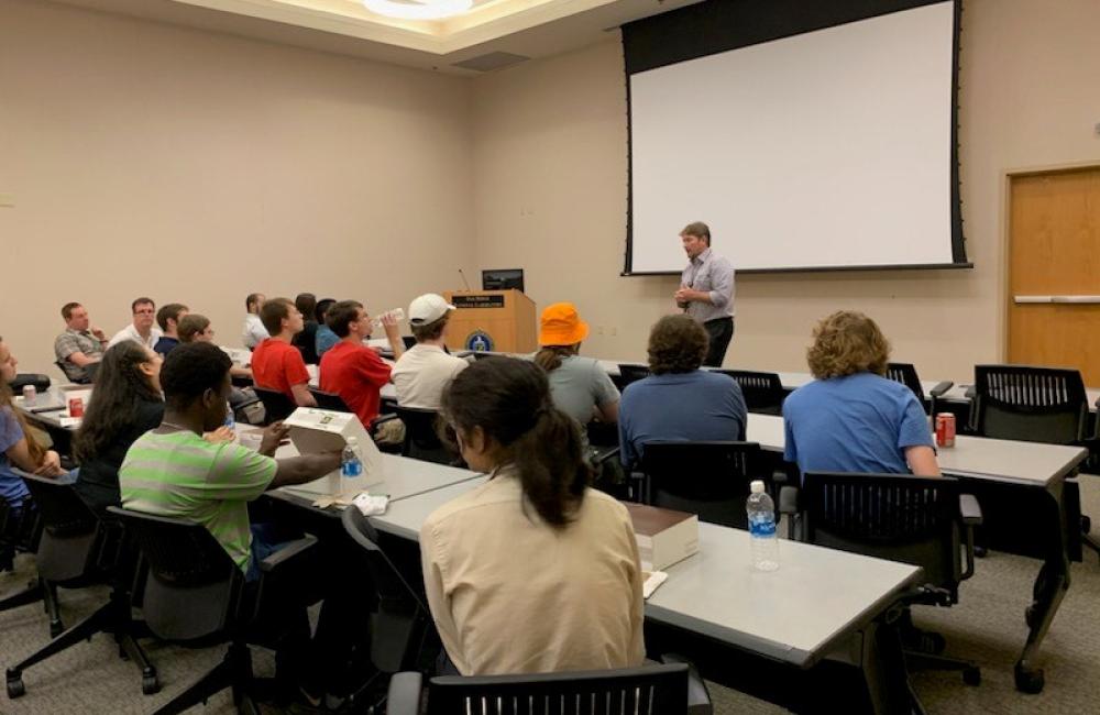 ORNL’s Travis Humble, Quantum Science Center director, addresses students during a working lunch. Credit: Teresa Hurt/ORNL, U.S. Dept. of Energy