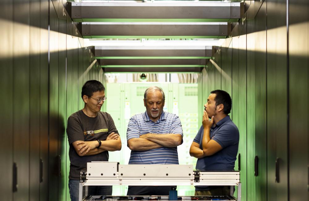 Members of the Analytics and AI Methods at Scale group in the National Center for Computational Sciences at ORNL developed the mixed-precision performance benchmarking tool OpenMxP. From left are group leader Feiyi Wang, technical lead Mike Matheson and research scientist Hao Lu. Credit: Carlos Jones/ORNL, U.S. Dept. of Energy